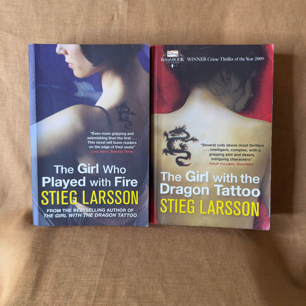 Millennium lot by Stieg Larsson: The Girl with the Dragon Tattoo and The Girl Who Played with Fire.