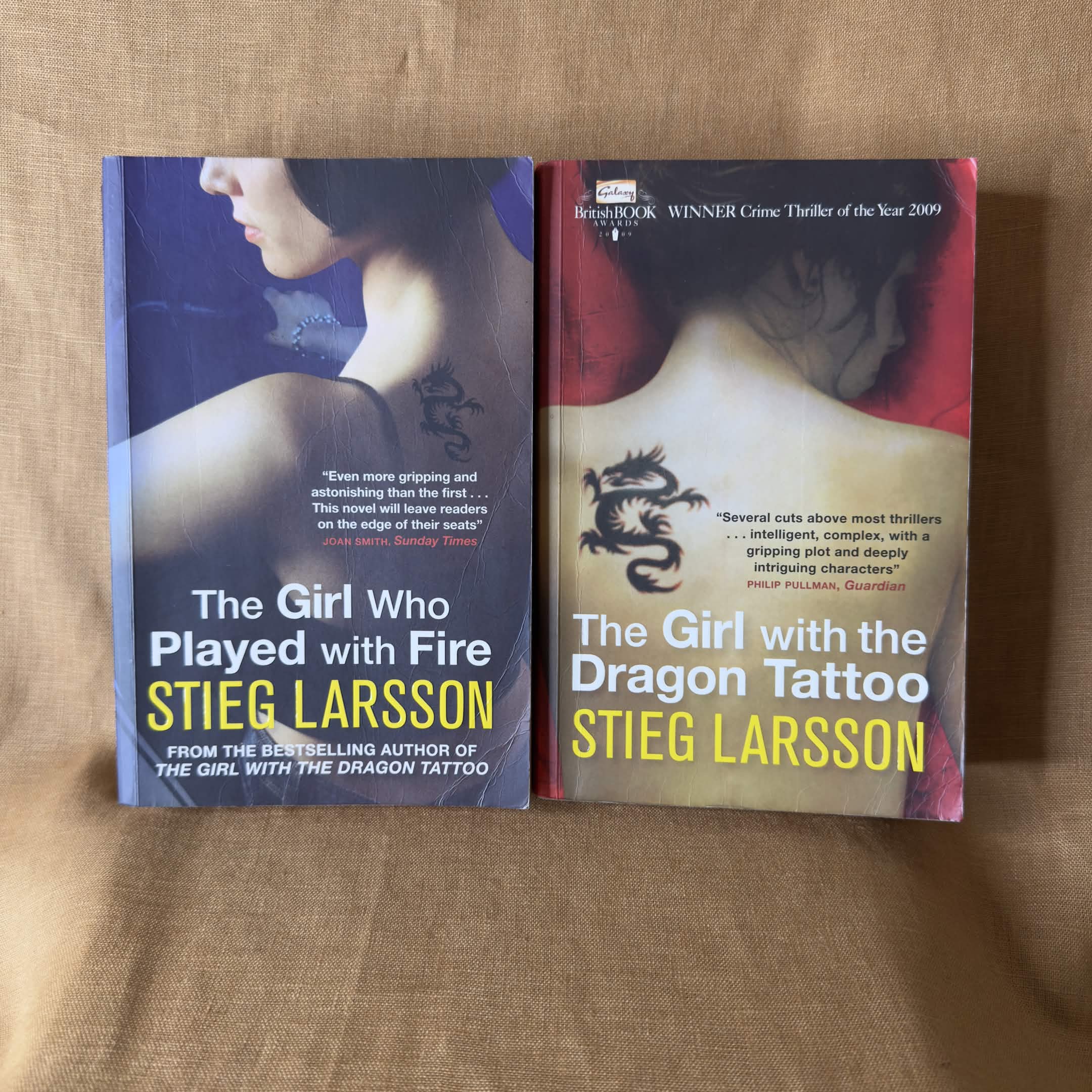 Millennium lot by Stieg Larsson: The Girl with the Dragon Tattoo and The Girl Who Played with Fire.